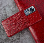 Close-up of crocodile embossed leather texture on luxury iPhone case - Red iPhone 17 Pro Max