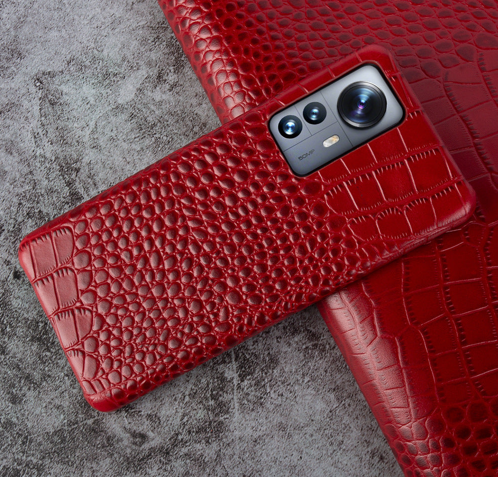 Close-up of crocodile embossed leather texture on luxury iPhone case - Red iPhone 17 Pro Max
