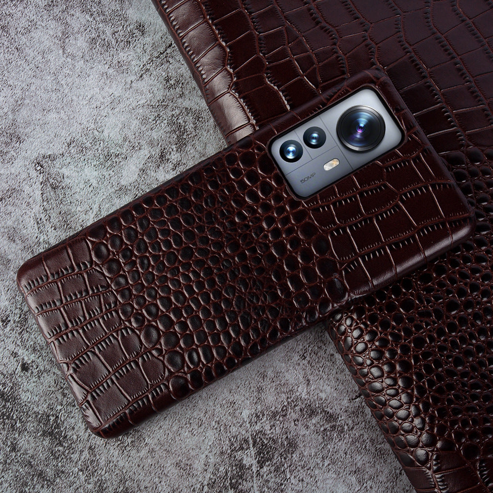 Close-up of crocodile embossed leather texture on luxury iPhone case - Dark Brown color for iPhone 17 Pro