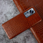 Close-up of crocodile embossed leather texture on luxury iPhone case - Light Brown color for iPhone 17 Pro Max