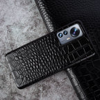 Close-up of crocodile embossed leather texture on luxury iPhone case - Black color for iPhone 17 Air